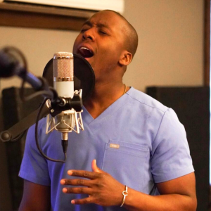 Take in this orthopedic surgeon's singing to lift your spirits
